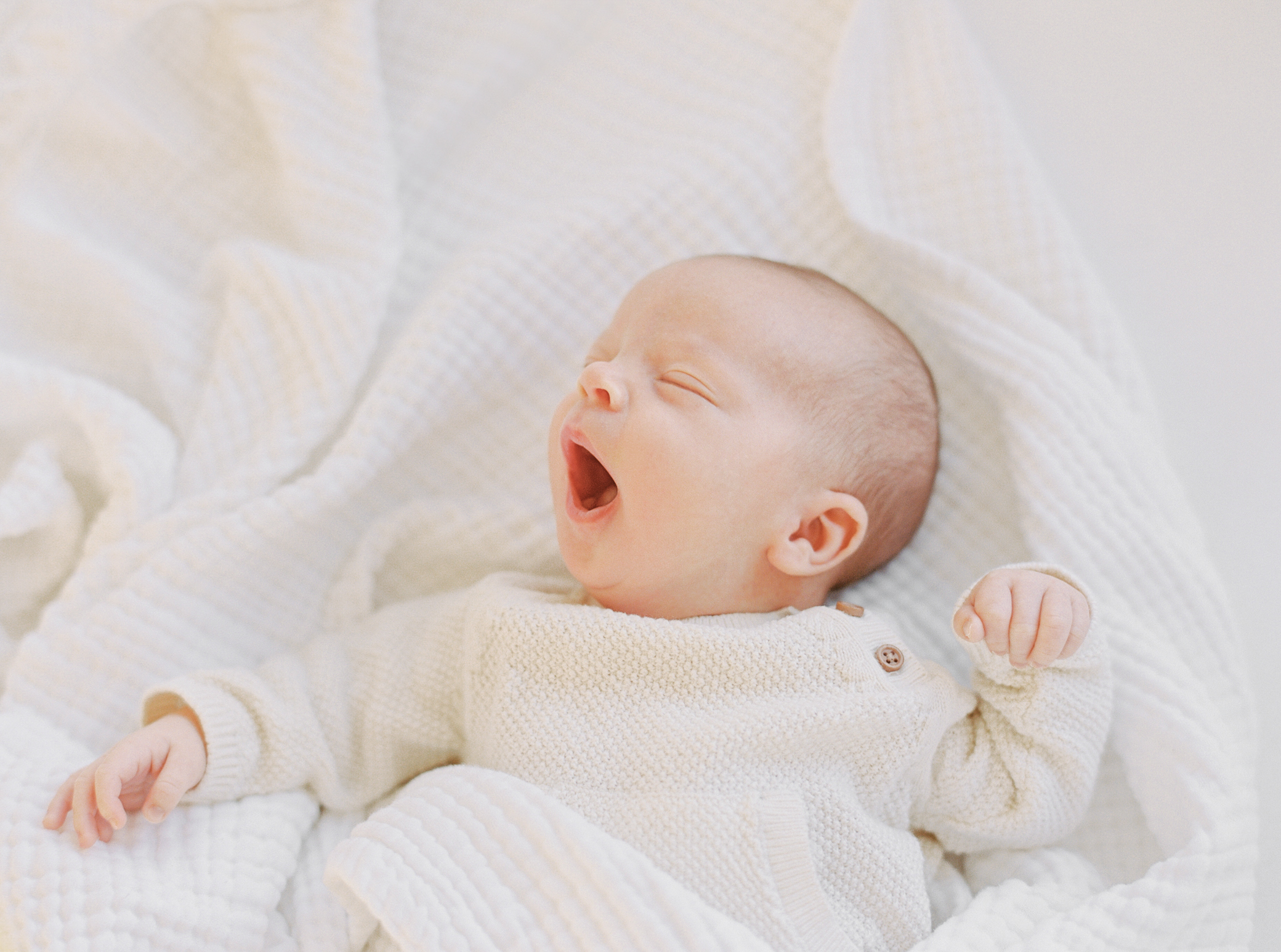 Kansas City Newborn Photographer photo of newborn yawning photographed on film